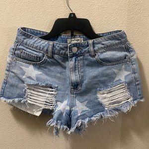 Ripped, jean shorts. Super cute for 4th of July, or any casual day. Mid waste.